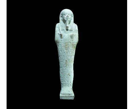 Egyptian Glazed Composition Hieroglyphic Shabti 26th Dynasty, 664-525 BC. A very large pale blue shabti with tripartite wig, 