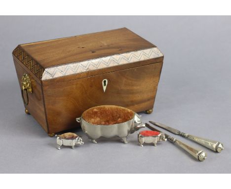 A miniature silver novelty pig pincushion, 4cm long; two larger silvered-metal ditto; a pair of manicure implements; &amp; a 