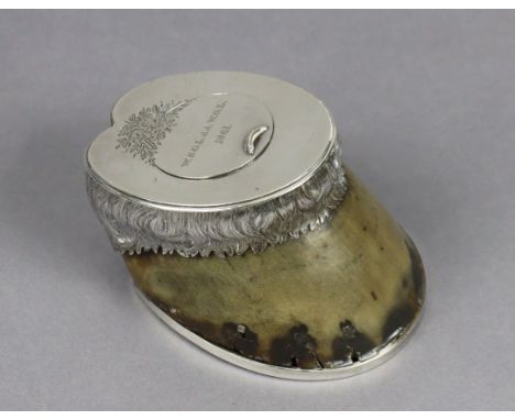 A Victorian pony-hoof inkwell with silver mounts, the hinged top inscribed “W.S.G.L. dd. W.G.L, 1861” 18.5cm wide x 7.5cm hig