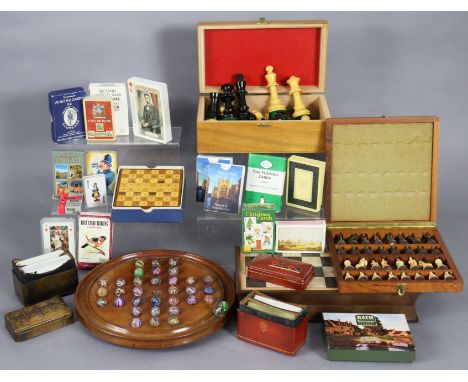 A boxwood chess set (size of Kings 9.5cm high), together with two other chess sets, a solitaire board, and various sets of pl