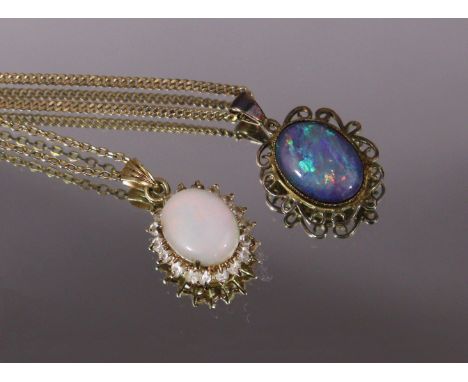 A black opal oval pendant on yellow metal chain necklace marked “375” (the chain 2.2gm); and another oval opal pendant with b