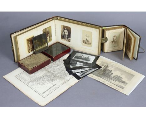 A vintage family photograph album containing sixty portrait studies, &amp; in a carved wooden binding; another family photogr