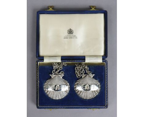 A pair of Elizabeth II silver scallop-shell design decanter labels “Brandy” &amp; “Vodka” Birmingham 1970 by Alfred Dunhill L