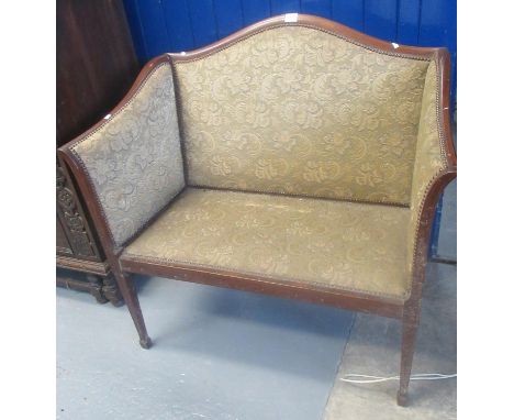 Edwardian mahogany show frame arched back two seater sofa, with padded upholstery on square tapering legs and spade feet. (B.