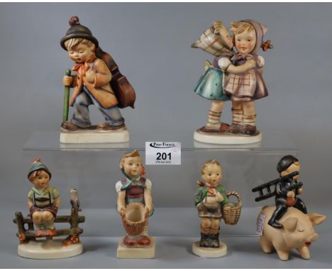 Collection of six Hummel figurines and figure groups to include boy with pig, boy with cello, girl and boy with baskets, etc.