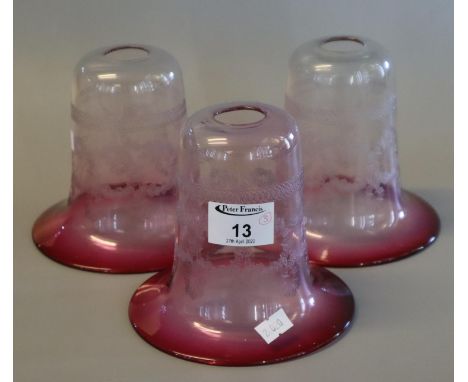Three cranberry glass, etched light shades. (3) (B.P. 21% + VAT)&nbsp;&nbsp;No obvious damage.&nbsp;