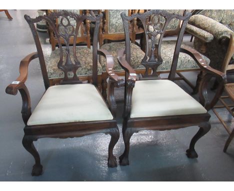 Pair of mahogany Chippendale style open arm chairs - having removable stuff over seat, standing on cabriole legs and ball and