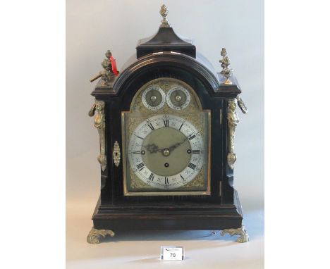 19th century three train ebonised bracket clock, the case with urn finials and term mounts, loop handles on scrolled feet. Ar