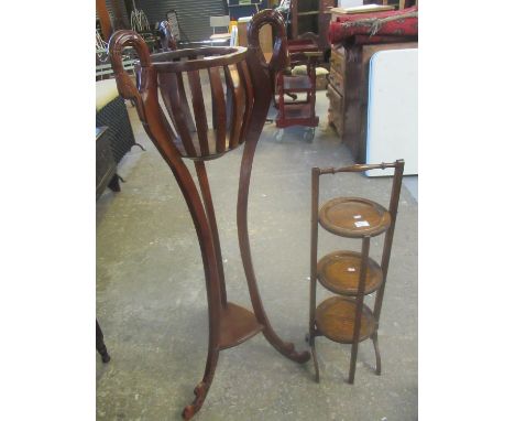 Mahogany jardiniere stand with swan neck mounts and triangular under shelf, together with an oak, folding three tier cake sta