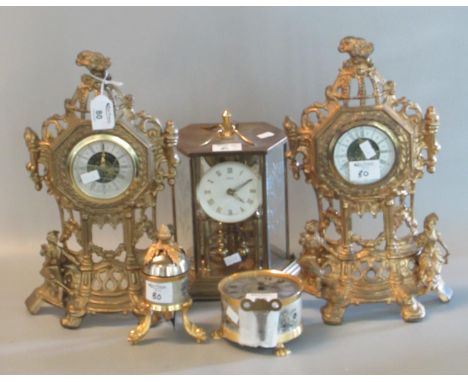 Group of assorted modern brass and gilt metal clocks various. Include 100 day perpetual motion type, two French design pierce