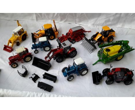 A selection of Britains tractor models & JCB motors 