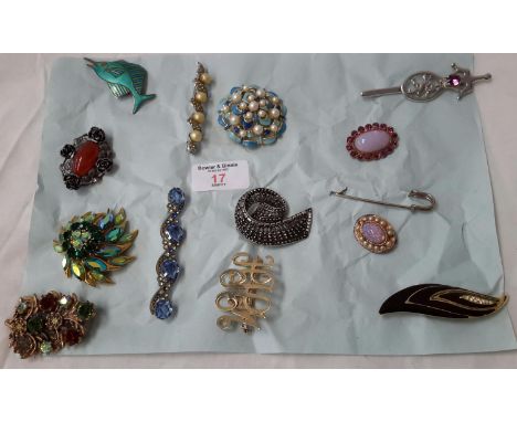 A card of various costume & silver brooches  to include silver & enamel sword fish brooch, together with flower & red stone b