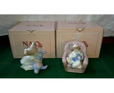 2 Nao girl figurines. 1 with doll & 1 with rabbit, both complete with boxes 