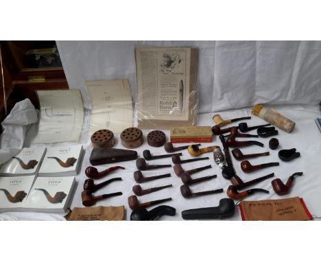 A large selection of smoking pipes to include names such as, 'The Guildhall London Pipe', Imperial & Black Meerschaum, togeth