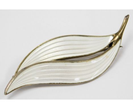 An Aksel Holmsen silver and white enamel brooch, of double leaf form, impressed marks.