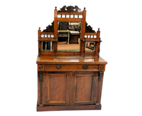 A Victorian walnut mirror back sideboard, with a central bevelled rectangular glass plate, flanked by two smaller glass panel