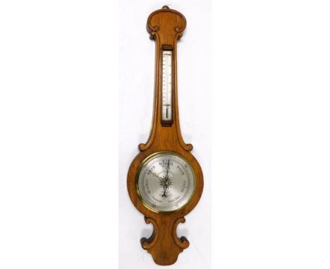 A Victorian oak cased wheel barometer, by Wood, late Abraham and Company, 20 Lord St, Liverpool, with silvered dial, and ther