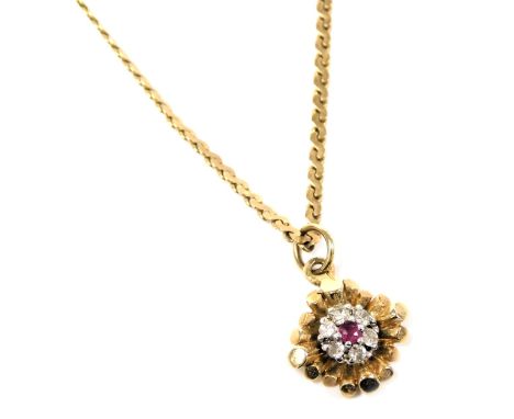 A 9ct gold ruby and diamond floral pendant, on a S link neck chain, with bolt ring clasp, 2.9g.