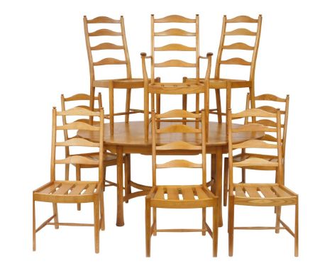 An Ercol light elm draw leaf dining table, raised on turned out swept legs, 74cm high, 162cm wide, 212cm extended, 107.5cm de