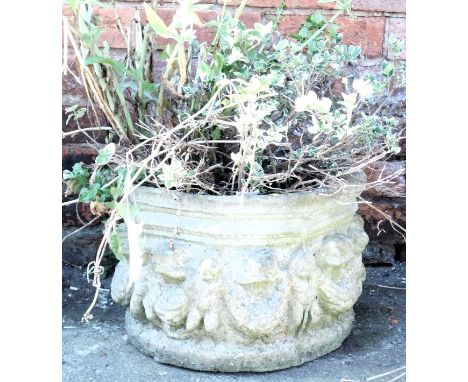 An octagonal garden planter, decorated with a band of putti and laurel swags, 40cm wide. 