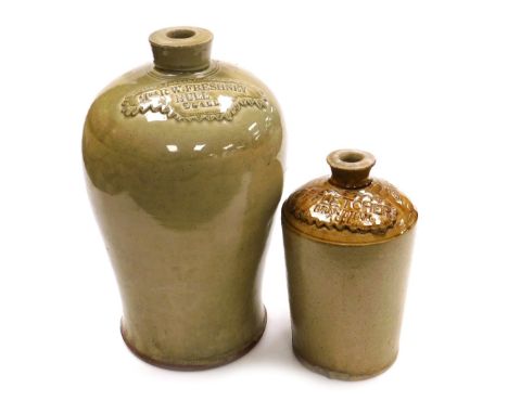A 19thC olive stoneware two gallon jar, number 101, with raised banner named for "Mrs R W Freshney, Hull", 40cm high, and a f