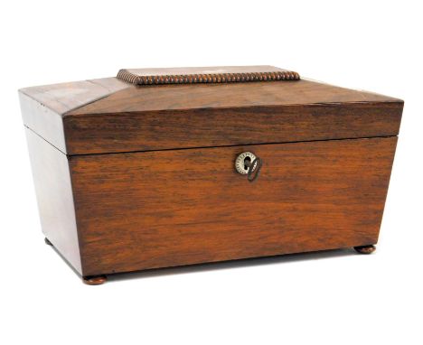 A Regency rosewood tea caddy, of sarcophagus form, with mother of pearl key escutcheon, the hinged lid opening to reveal two 