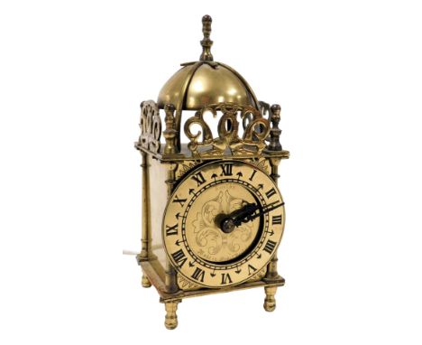 A 20thC Smiths brass lantern clock, chapter ring bearing Roman numerals, with electric movement, 18cm high.