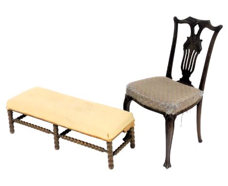A Victorian oak duet stool, upholstered in yellow fabric, raised on bobbin turned legs united by bobbin turned stretchers, 95