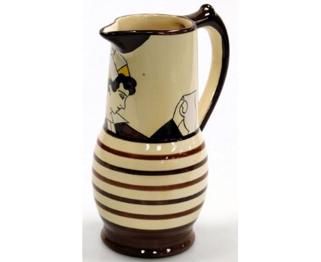 A 20thC Quimper pottery jug, painted with a head and shoulders study of a lady in traditional Breton costume, above brown ban