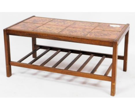 A mid century teak and tile top coffee table, of rectangular section, raised on square legs united by a slatted under tier, 4