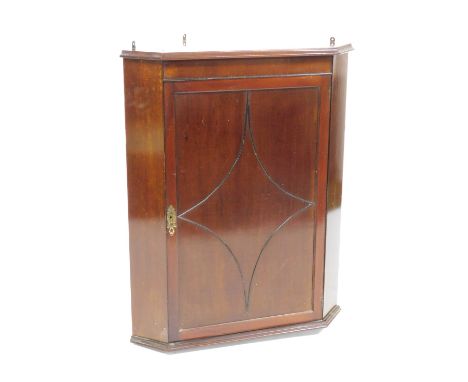 A 19thC mahogany hanging corner cupboard, enclosing two shelves on a plinth base, 85cm wide, 67cm high, 42.5cm deep.