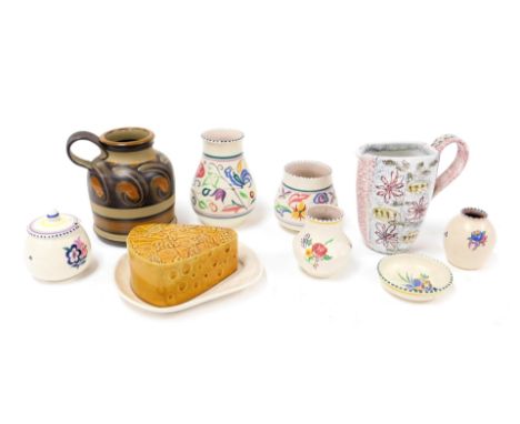 A group of Poole pottery, traditionally decorated with flowers, including vases, and a preserve pot and cover, together with 