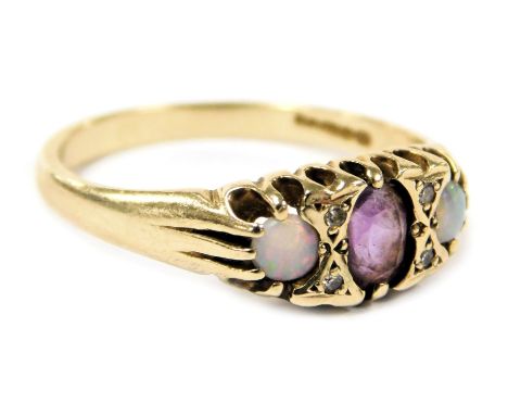 A 9ct gold amethyst and opal three stone ring, claw set, size O, 2.3g.