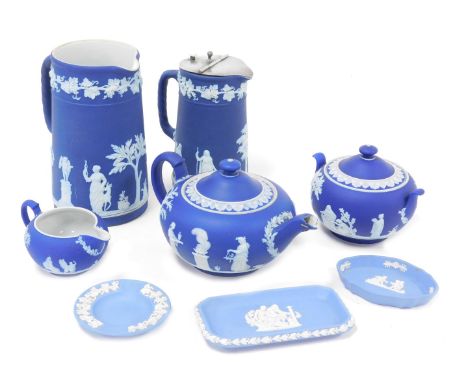A group of Wedgwood dark and light blue Jasperware, including a tea pot, sucrier and cream jug, and a covered water jug. (qty