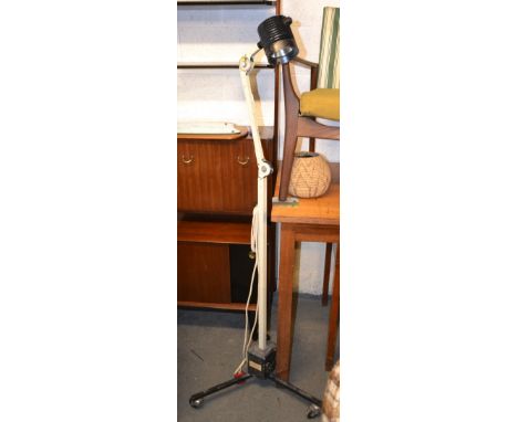 A vintage 20th century floorstanding anglepoise Industrial lamp by Standard mobile having castors to base with tall column