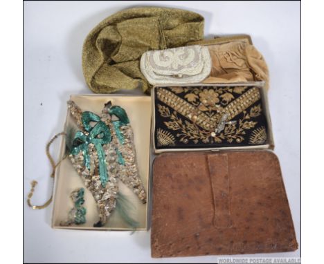 A vintage mid century snakeskin ladies clutch bag together with a vintage threadwork purse, bead purse, filigree top gold ton