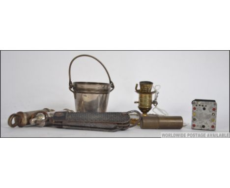A collection of items to include a match strike in the form of a bucket, military 1946 pen knife, Hudson 1915 whistle, Acme S