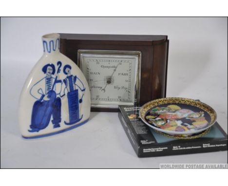 A vintage 20th century Bakelite cased barometer along with a Russian made blue and white vase and a Rosenthal collectors plat