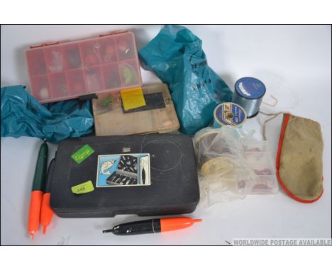 A collection of vintage fishing accessories to include fly's, floats, hooks, Red Gill lures etc predominately sea fishing