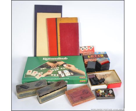 A collection of vintage / retro board games and parlour games  to include tinned dominoes, board games retailed by a local Ga
