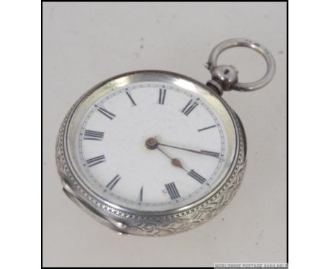 A continental ladies pocket watch enamel faced with roman numeral chapter ring. silver bear stamp  for Switzerland and marked