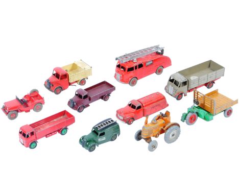 A collection of x10 original vintage Dinky Toys diecast model trucks and tractors to include; 555 Fire Engine, 27C Motorcart,