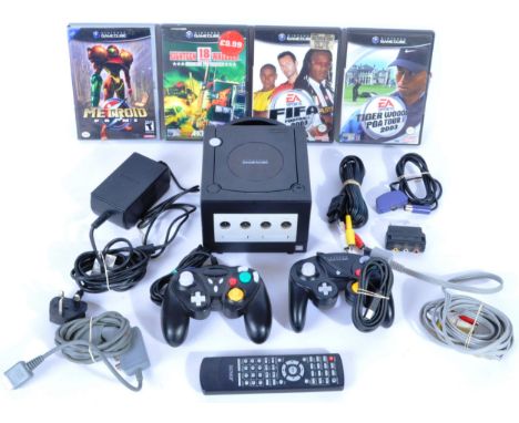 An original Nintendo made GameCube / Game Cube video computer games console with games and accessories comprising a black edi