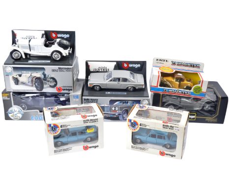 A collection of x7 assorted 1 /18 and 1 /24 scale boxed diecast model cars by makers Bburago / Burago, ERTL and Universal Hob