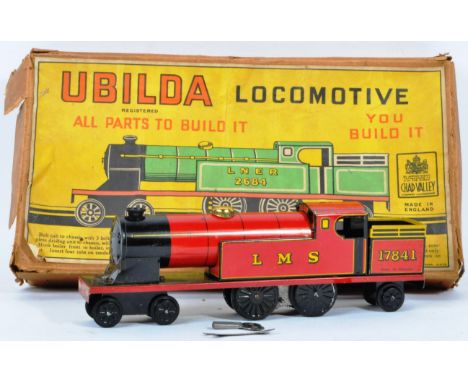An original vintage Chad Valley tin plate clockwork ' Ubilda '&nbsp;4-4-2 Tank Locomotive. The pre-made kit appearing complet