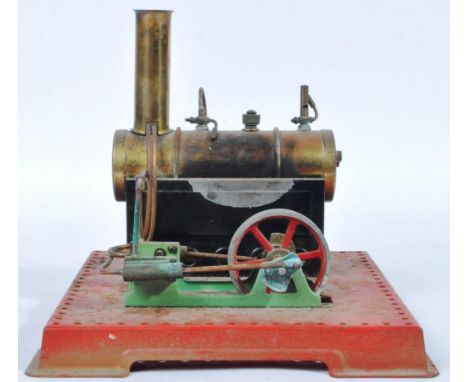 An original vintage Mamod made tinplate live steam S.E.2. / SE2 Stationary Engine. The model on a red tinplate base with bras