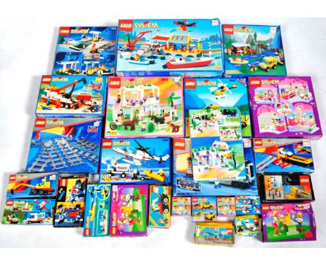 A large collection of approximately x25 original vintage empty Lego boxes, storage tubs / containers and a selection of instr