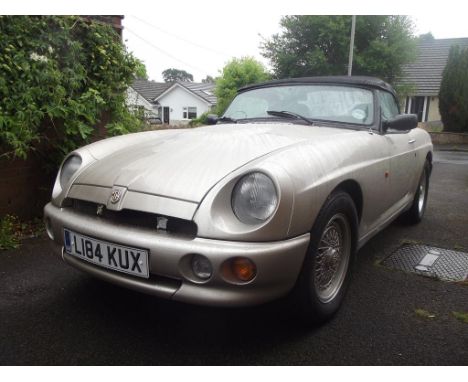 A 1994 MG RV8, registration number L184 KUX, chassis number SARRAWBMBMG000414, engine number UEA48A0000257, White gold. The R