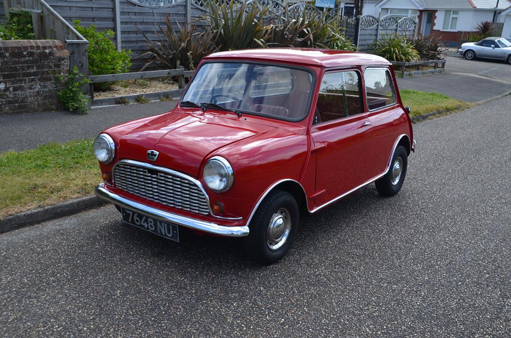 A 1964 Austin Mini 850, registration number 7648 NU, tartan red, this ...