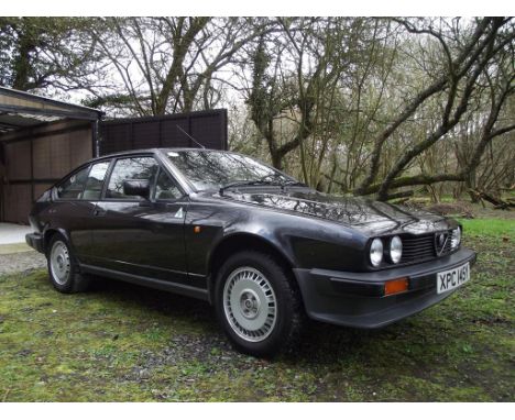 A 1982 Alfa Romeo Alfetta GTV 2 Litre, registration number XPC 145 Y, black. Introduced in 1976, the Alfetta GTV was a true d